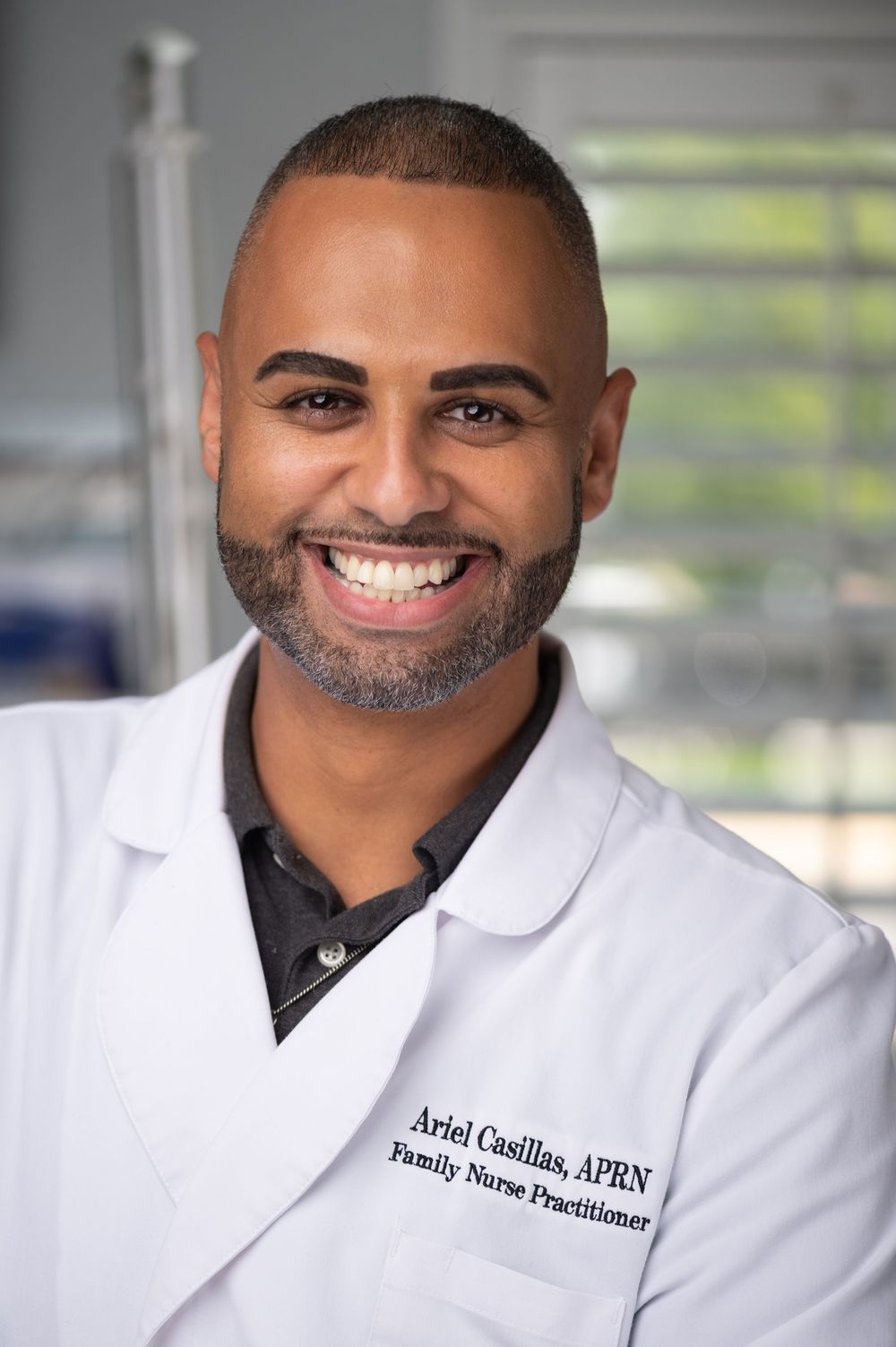 Orlando on-location headshot photographer Ray Alvarez — doctor headshot photographed in healthcare setting