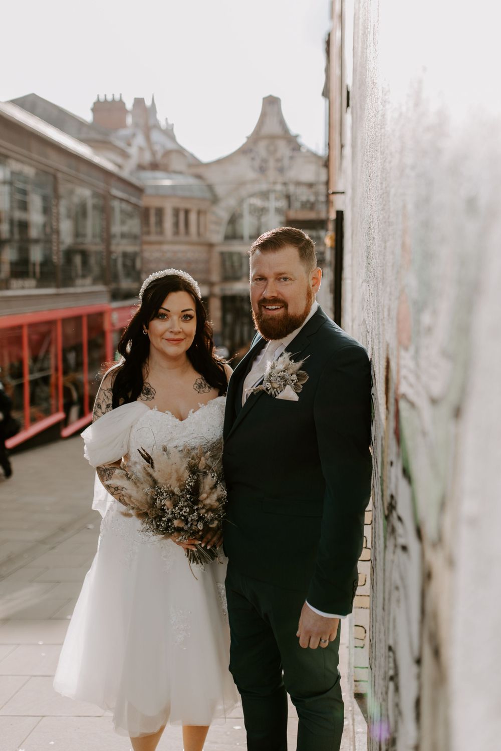 bride and groom stood in the city centre.