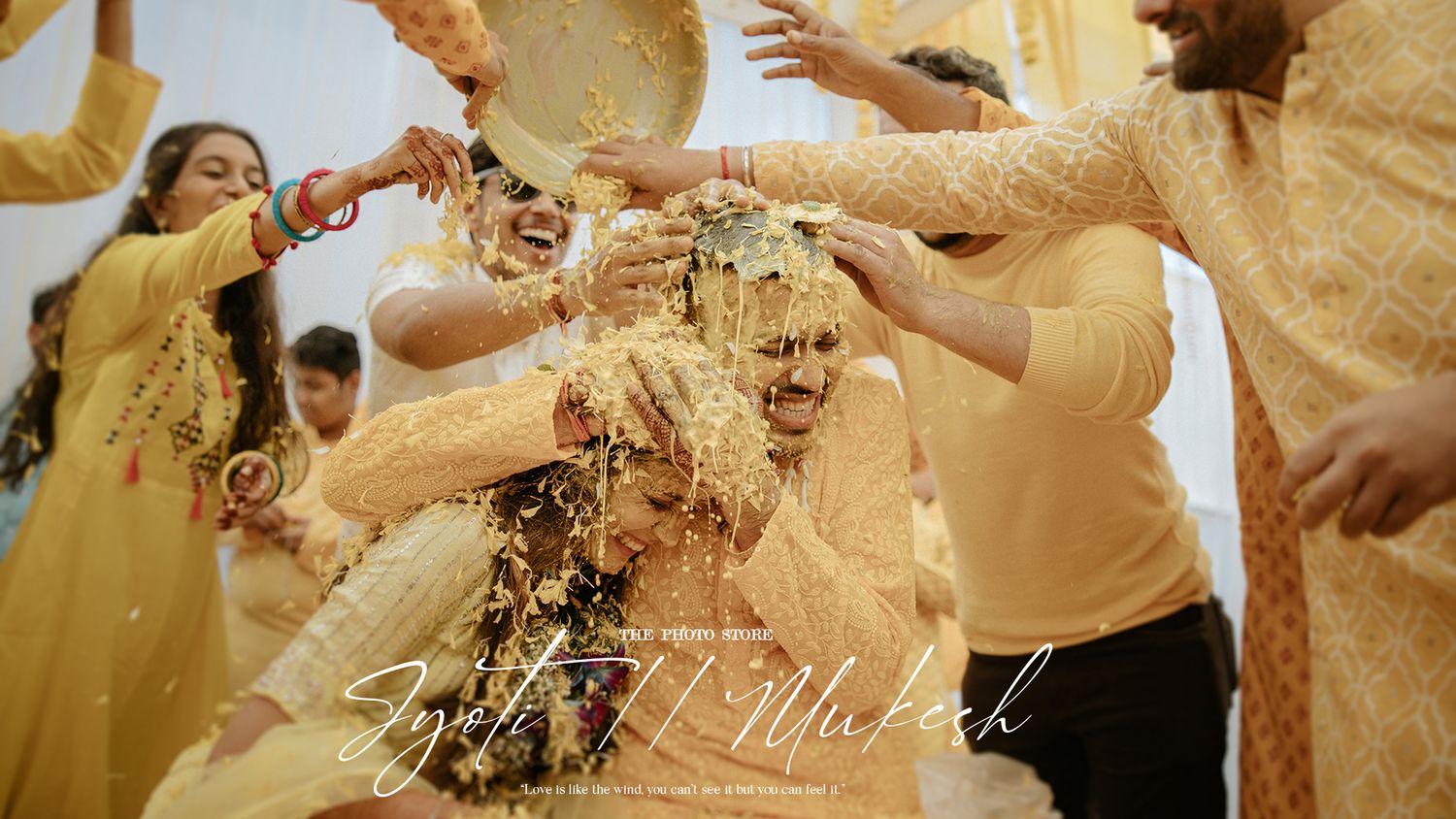 Celebratory moment with hands throwing yellow flower petals in the air.