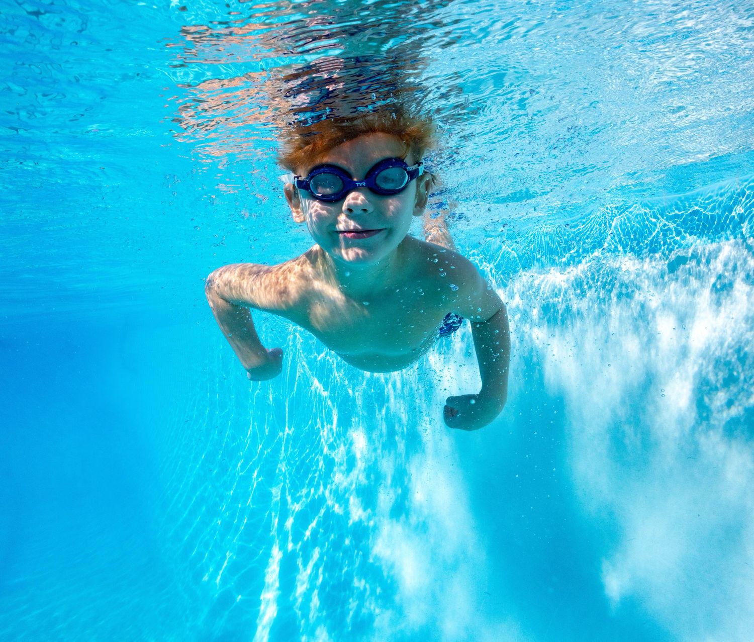 Kids swimming underwater photo