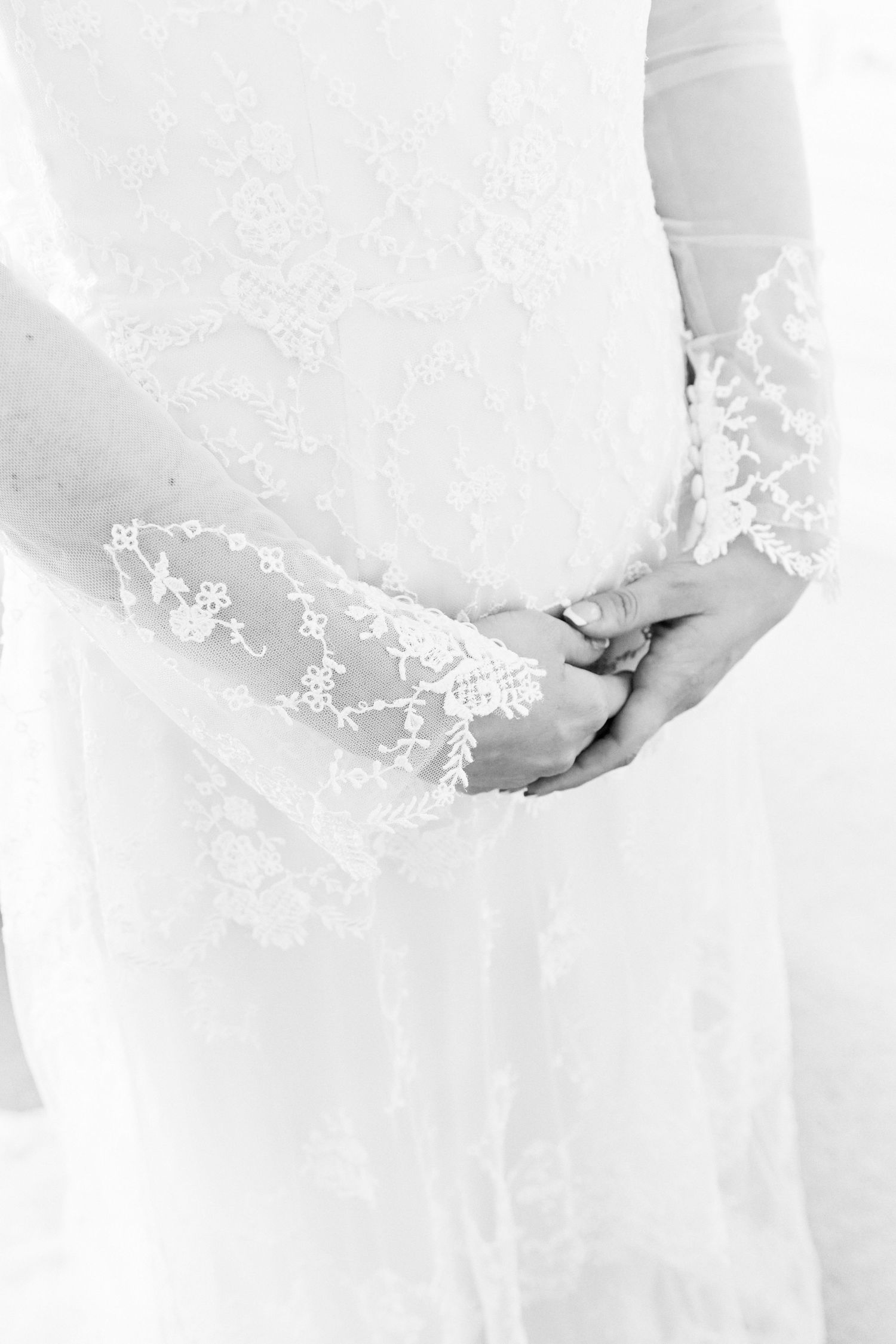 Orsett Hall close up of wedding dress lace on bride. by Norwich's best wedding photographer Faye Amare