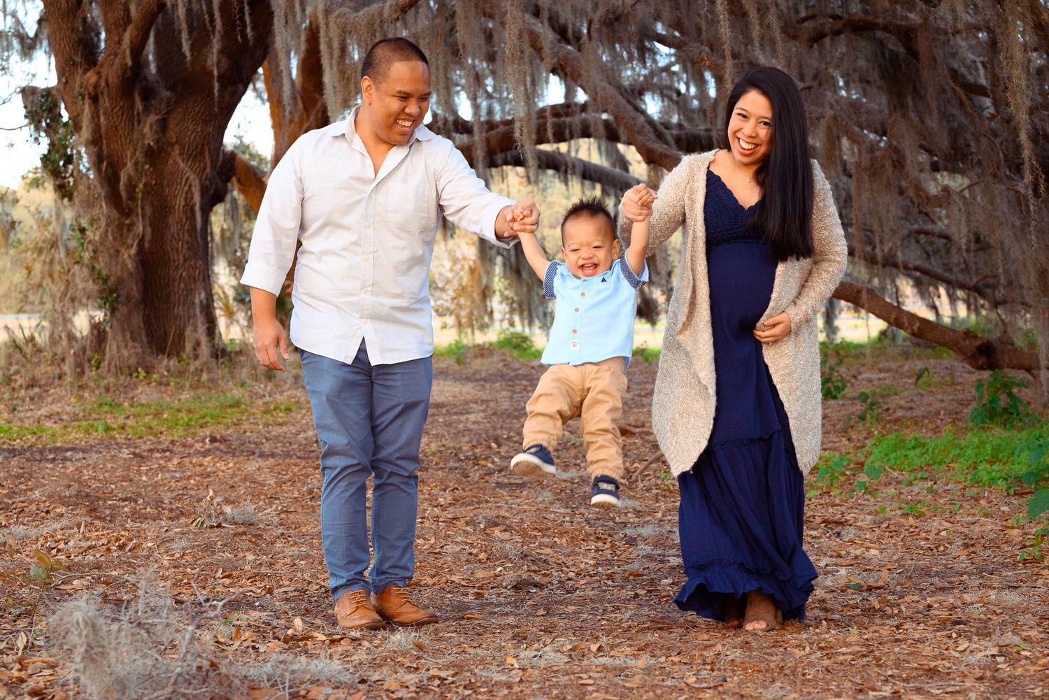 Deligero Family Sunset Maternity Portraits at Lake Conservation Area, Winter Garden, Florida.