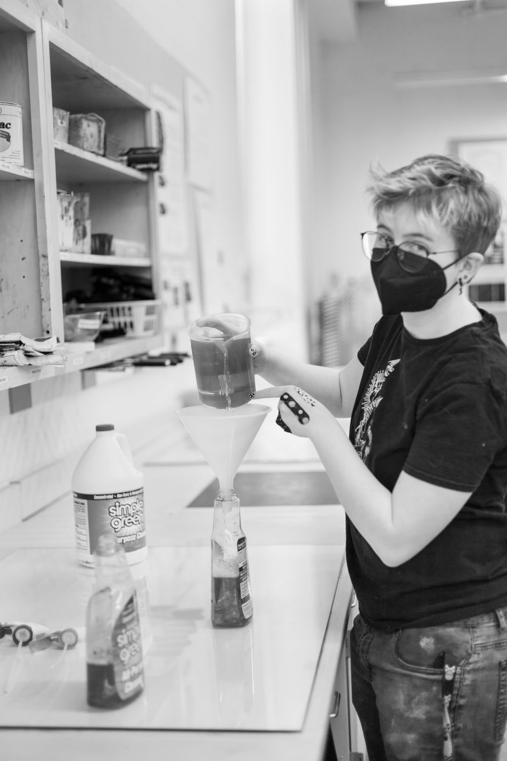 Sequential photos of someone drinking from a jar in a kitchen setting.