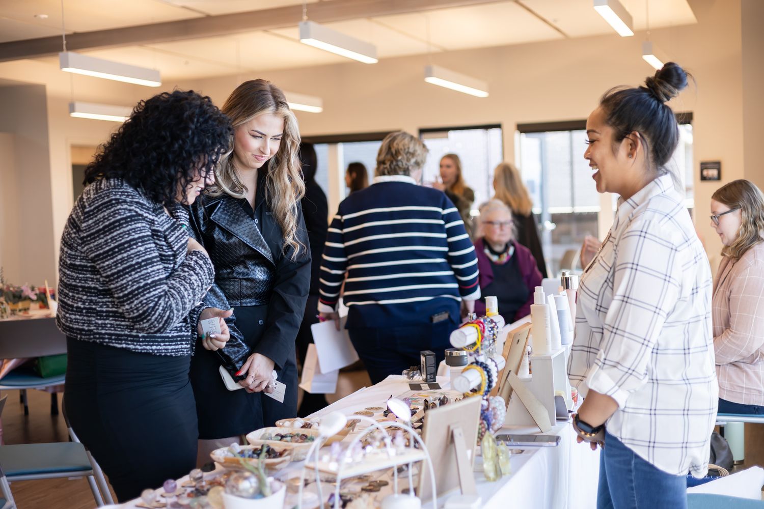 The Divine Pearl Collective women event photography in Edmonds, WA 2 women shopping woman owned crystal booth