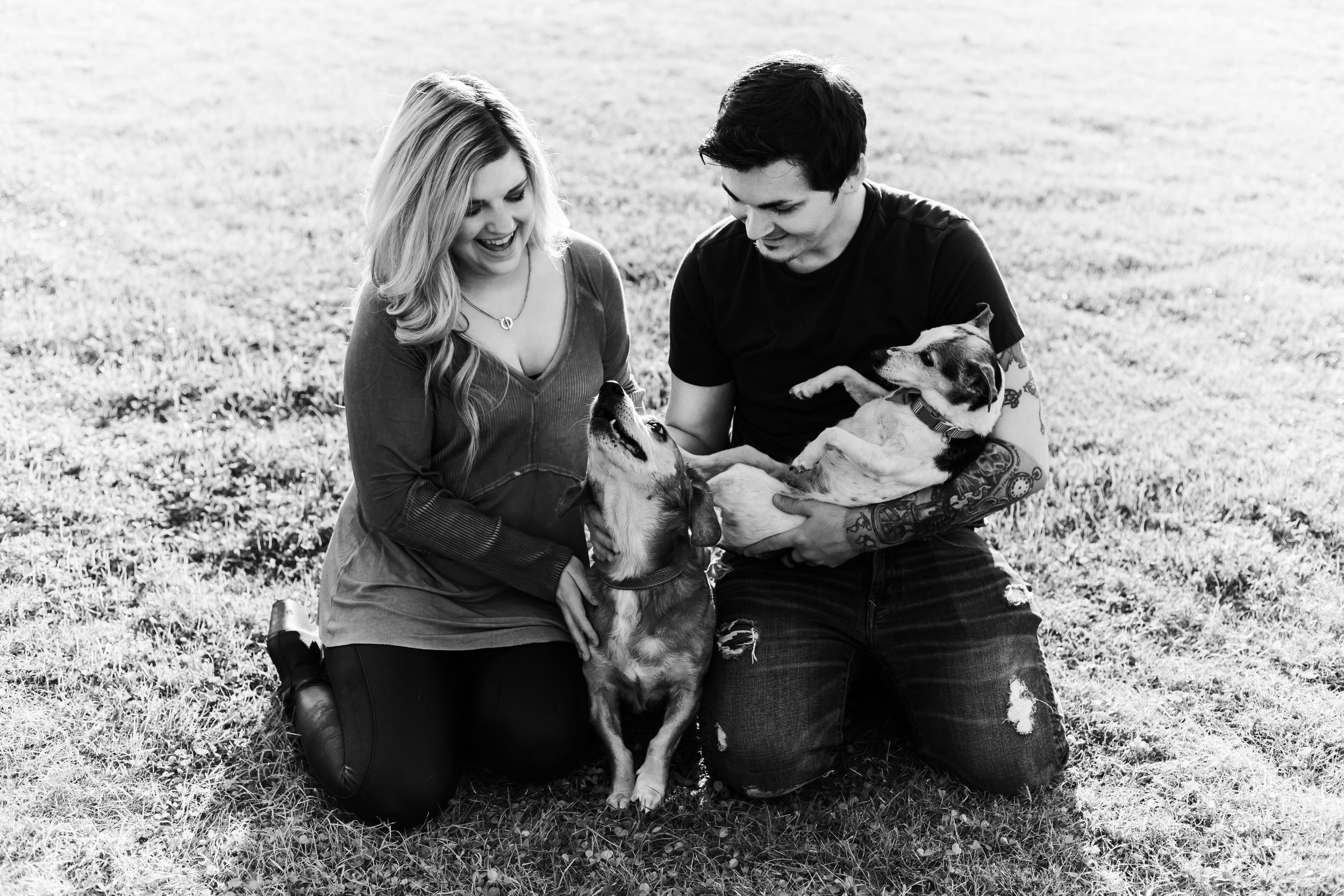 couple admiring their older dogs