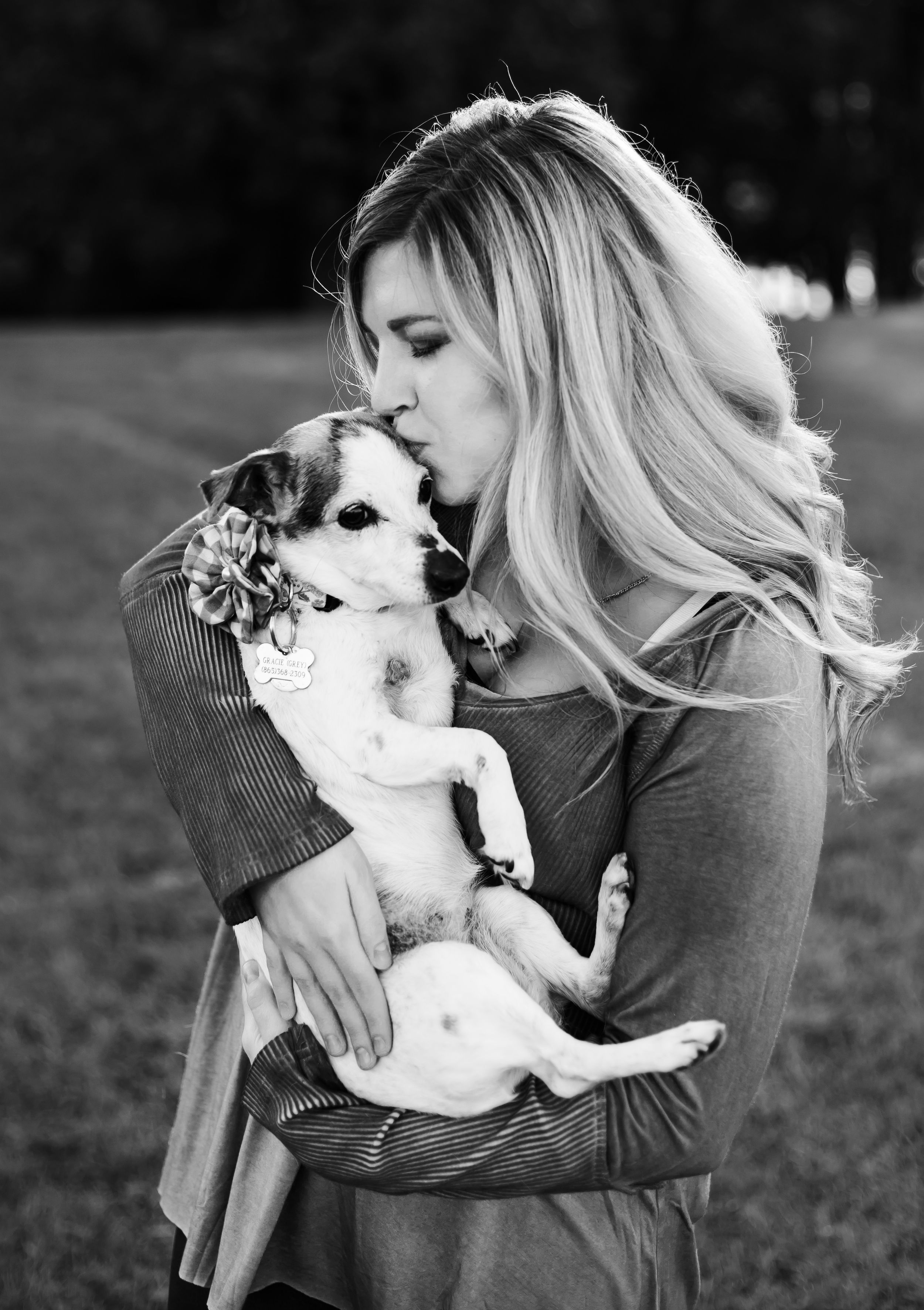 portrait of a blonde girl and her jack russell terrier