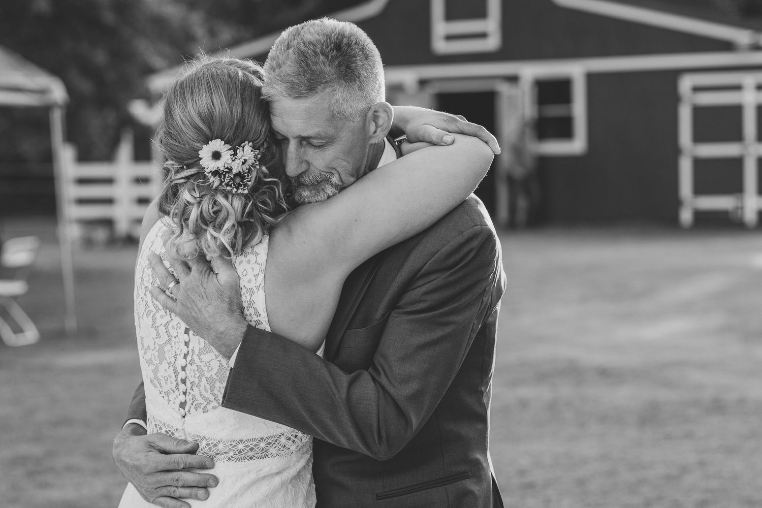 dad and daughter embrace wedding photo