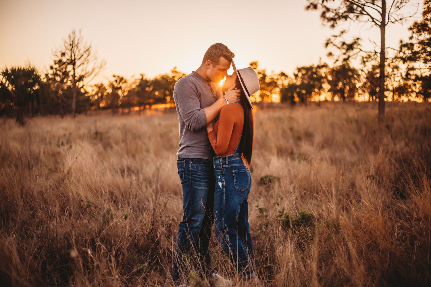 Tampa Engagement Photographer- Tampa Couple Photographer- Bok Tower photographer- Couple in tall grass at sunset
