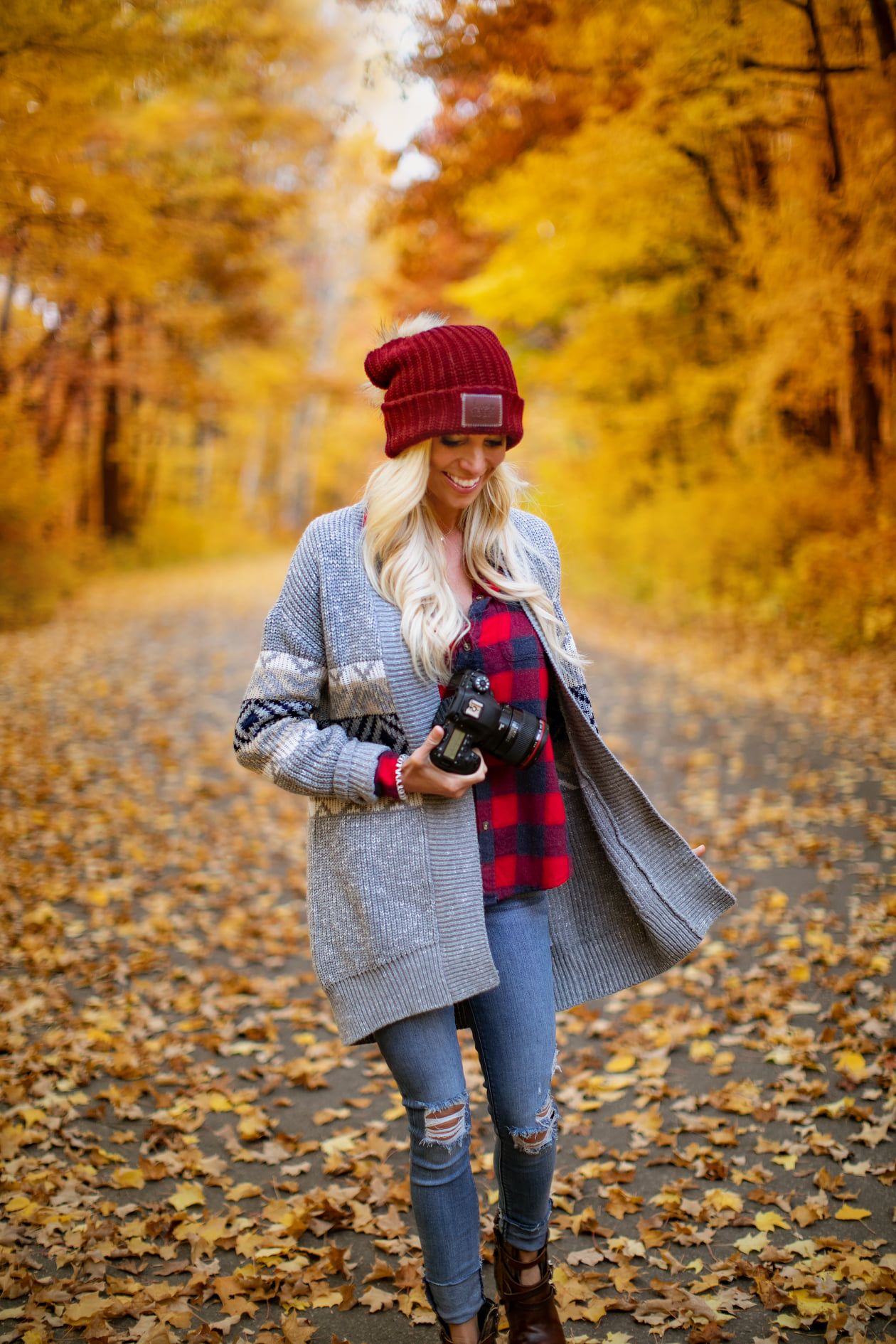 Minnesota Photographer on a path with yellow fall leaves