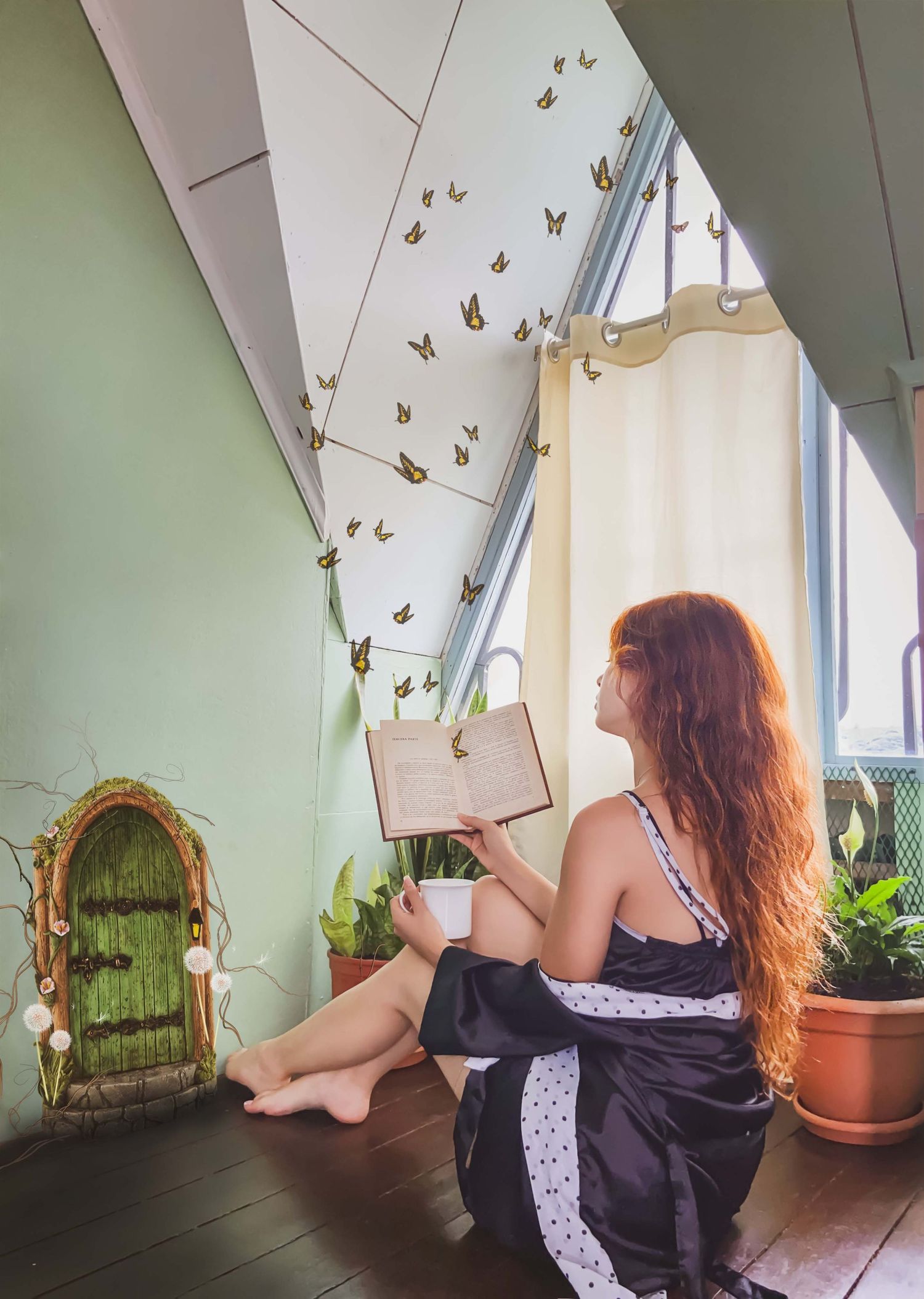 Whimsical reading nook with fairy door and golden butterflies on mint green walls.
