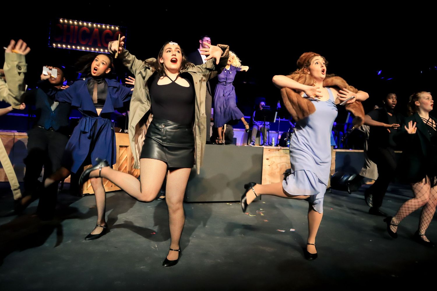 Actors from CHICAGO dancing