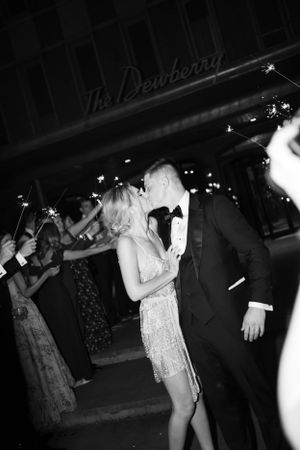 Dancing couple at The Dewberry venue during nighttime celebration.