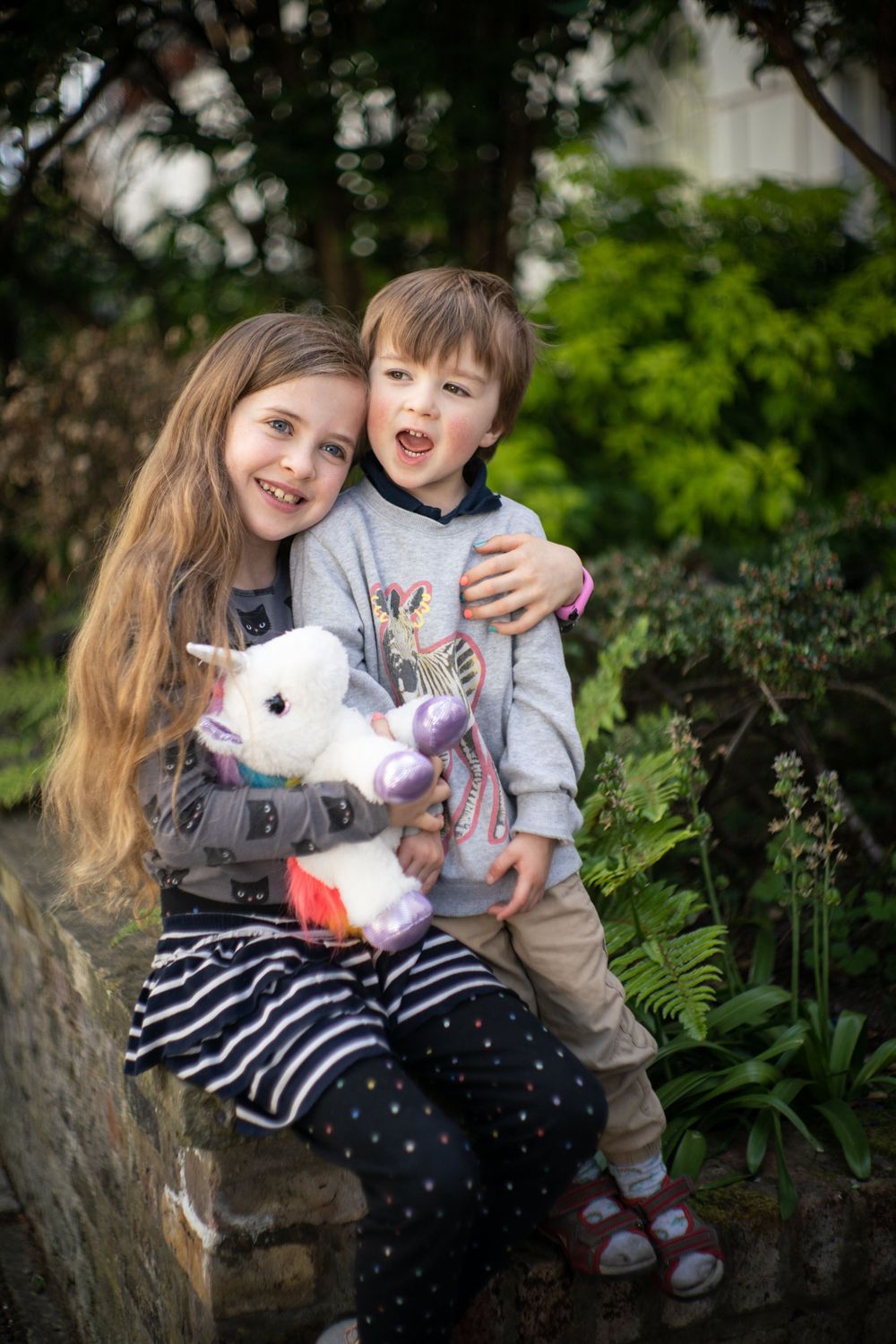 siblings pose for doorstep portraits during pandemic