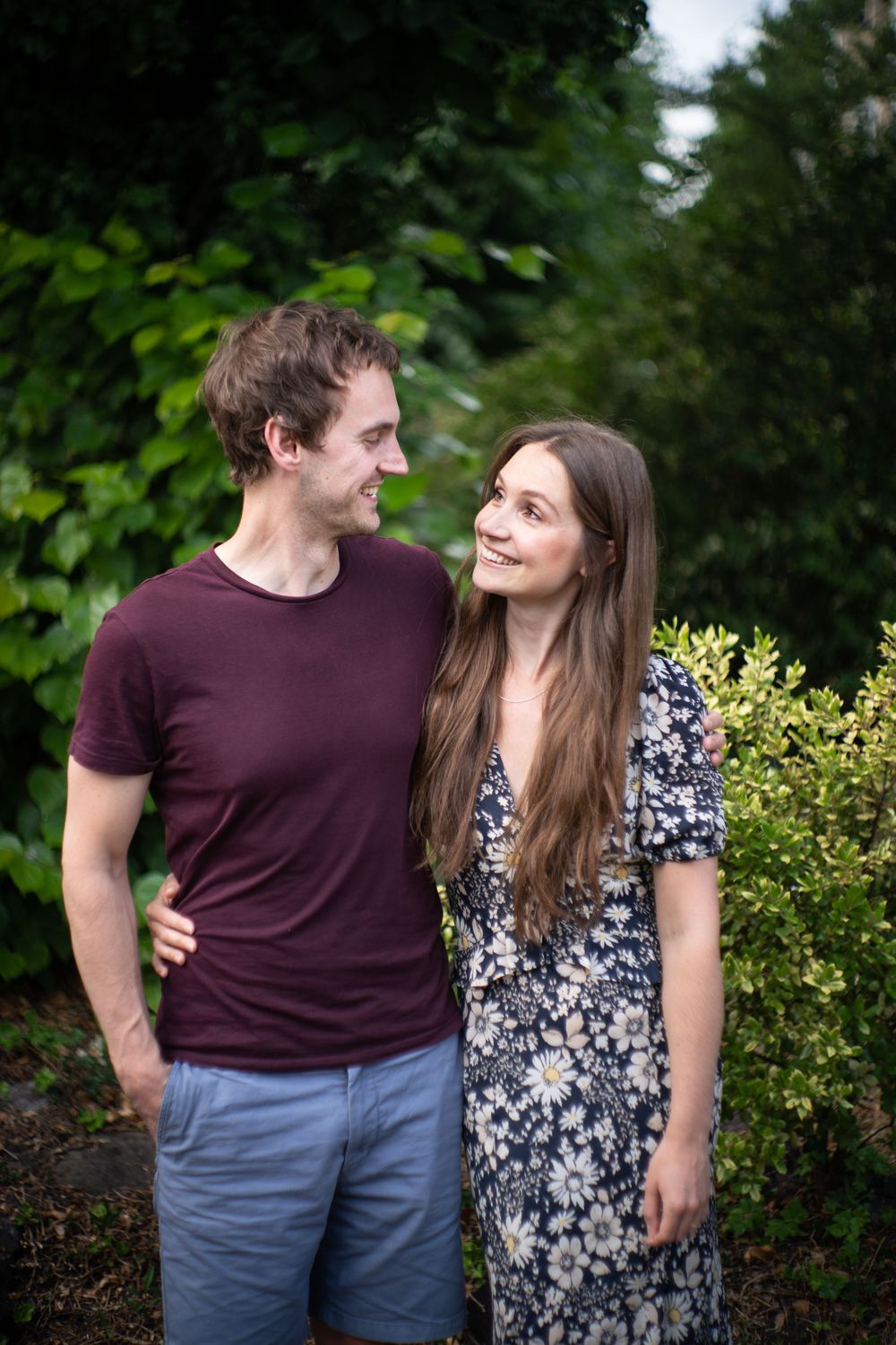 engaged couple pose for a doorstep portrait during the pandemic