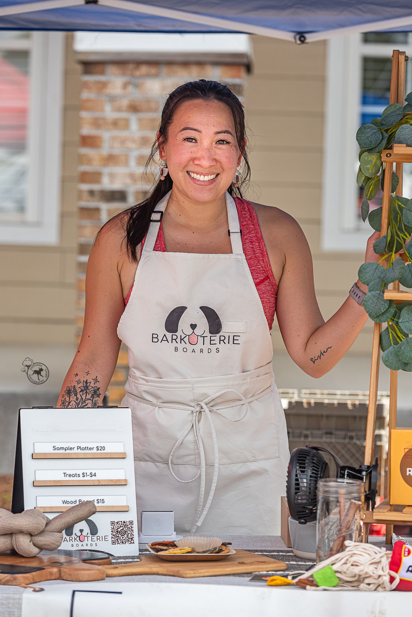 Owner of Atlanta's Barkuterie Boards mans a table at Modern Companion's Fall Fido Fest in Chapin, SC.