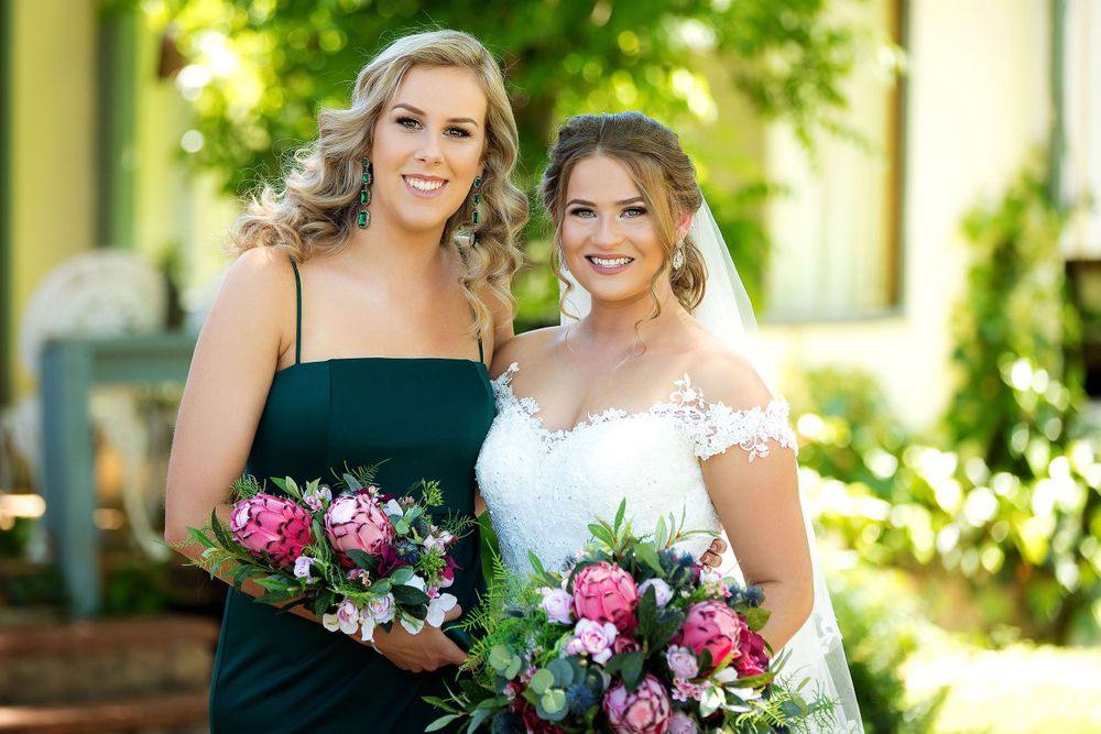 Bride with bridesmaid at The Chapel at Gold Creek wedding in Canberra