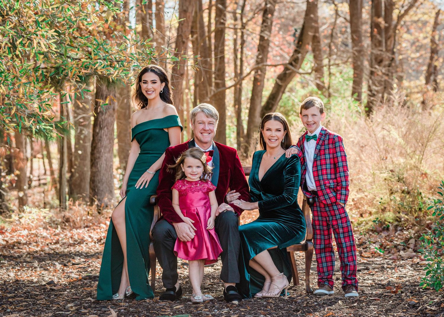 Seasonal family photo session in a scenic outdoor location, perfect for holiday cards.