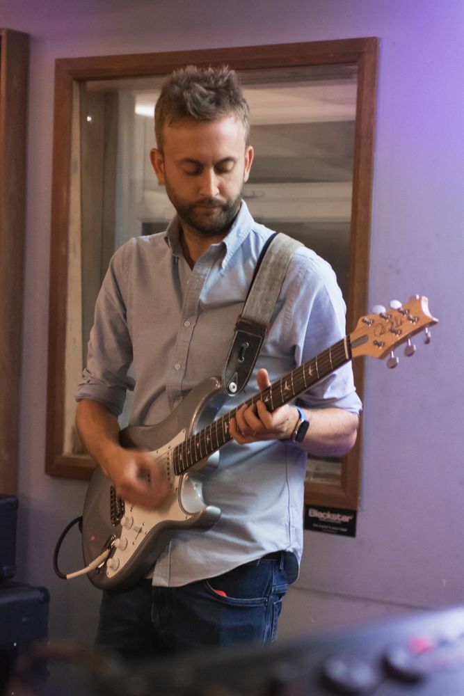 man playing bass guitar