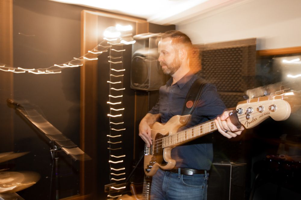man playing bass guitar