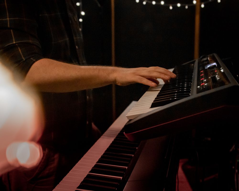 man playing keyboard