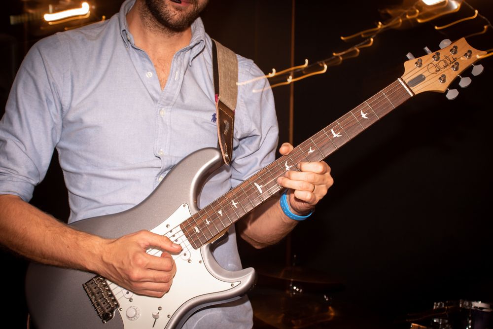 man playing electric guitar