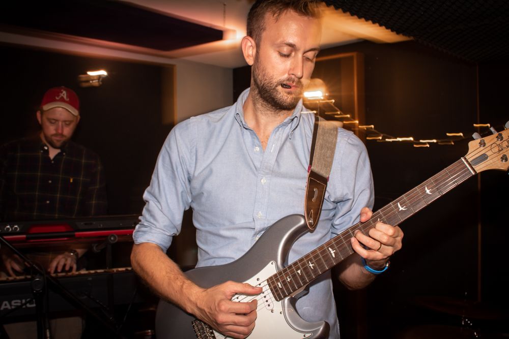 man playing electric guitar