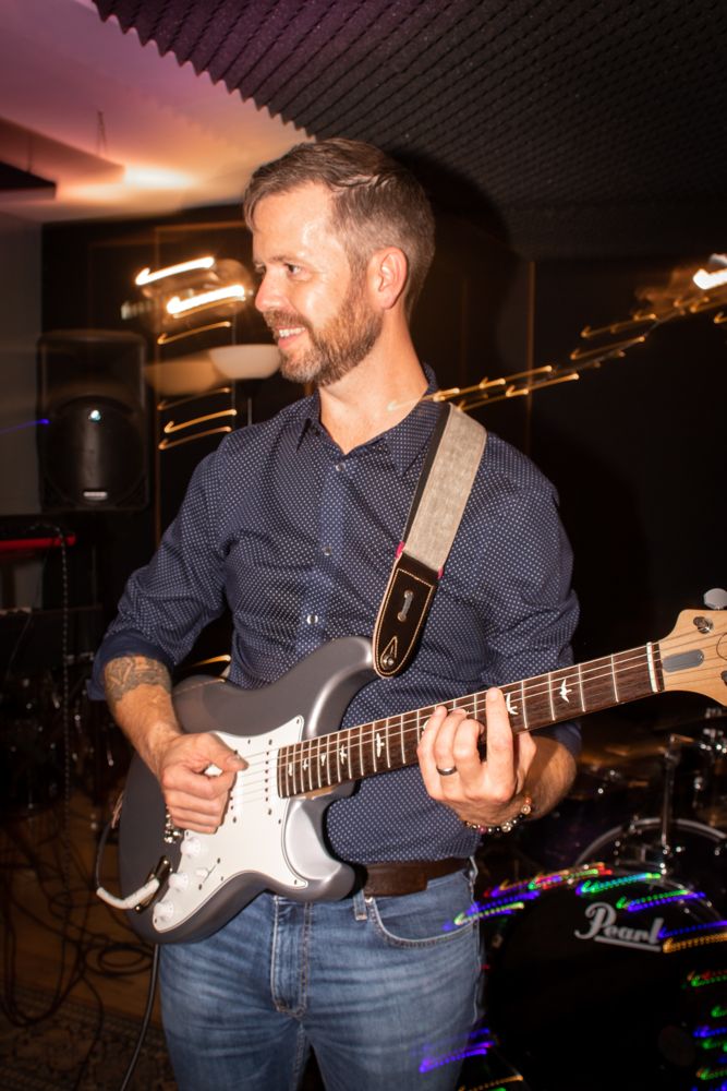man playing electric guitar