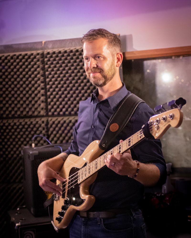 man playing electric guitar