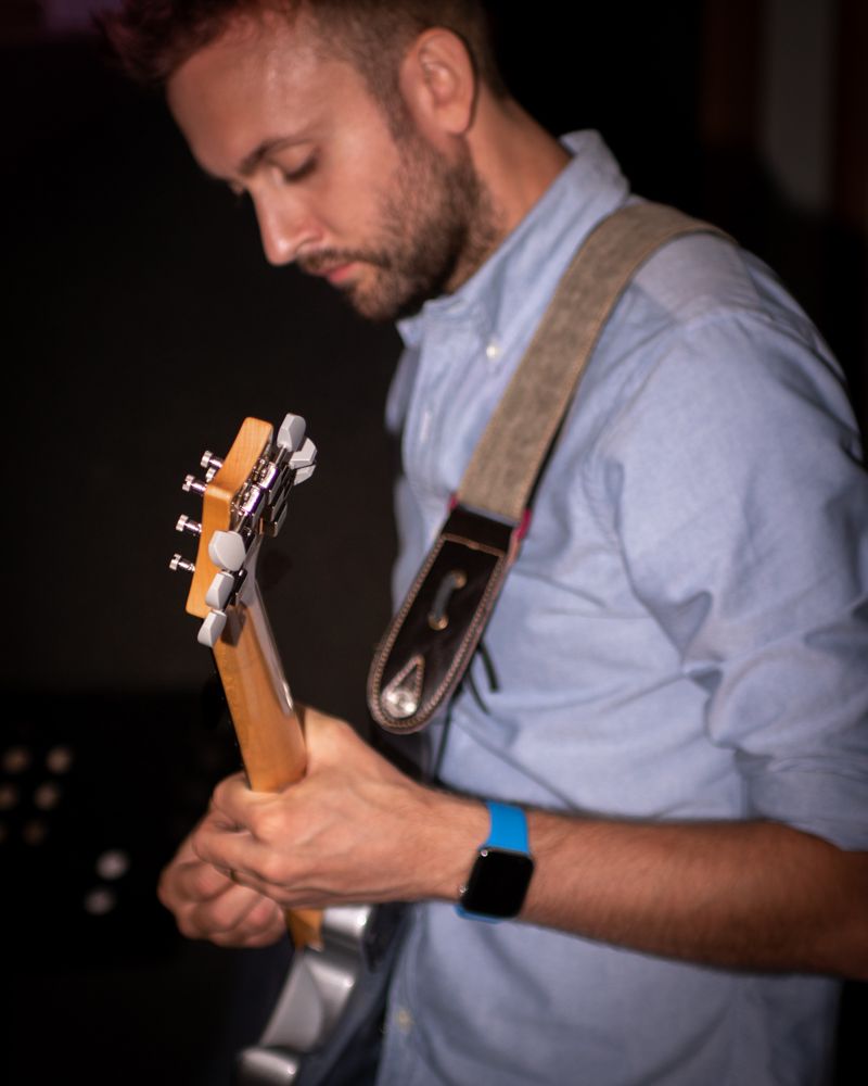 man playing electric guitar