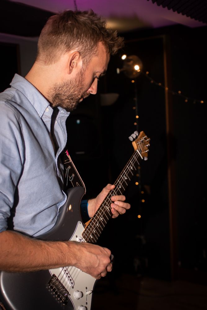 man playing electric guitar