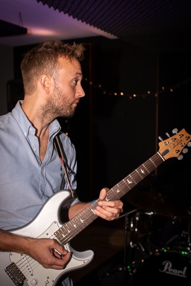 man playing electric guitar