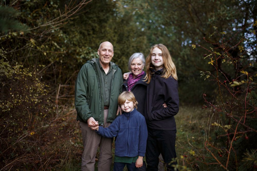 Seattle extended family photo shoot: A grandma and grandpa with their grandsons at a family photo shoot in Discovery Park Seattle WA