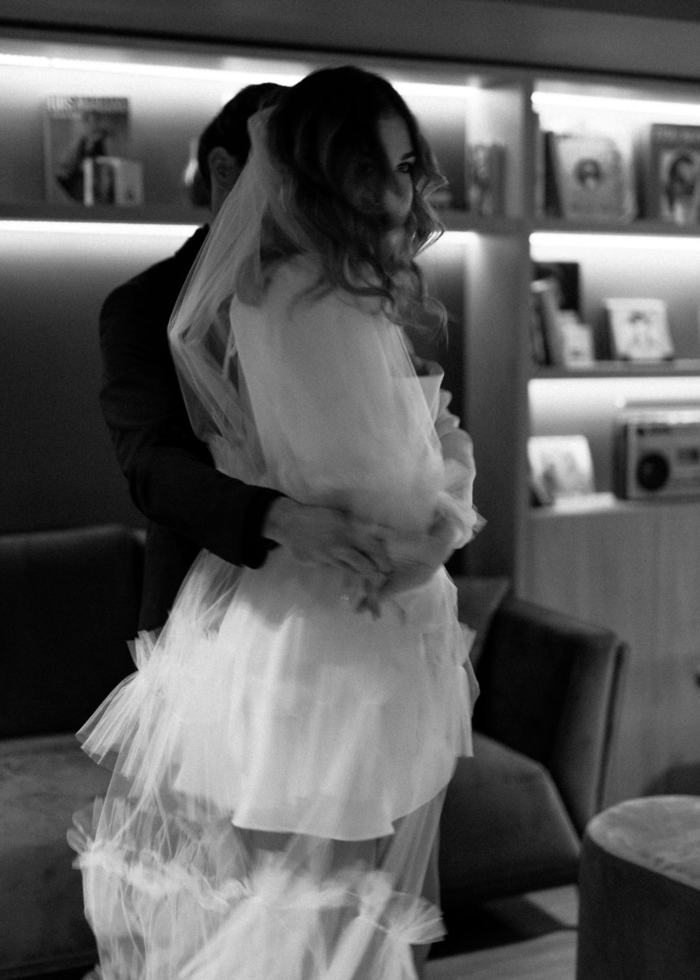 Romantic black and white photos of a couple in formal attire.