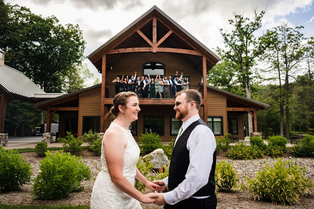Rustic wooden lodge exterior with timber frame details and landscaped gardens.
