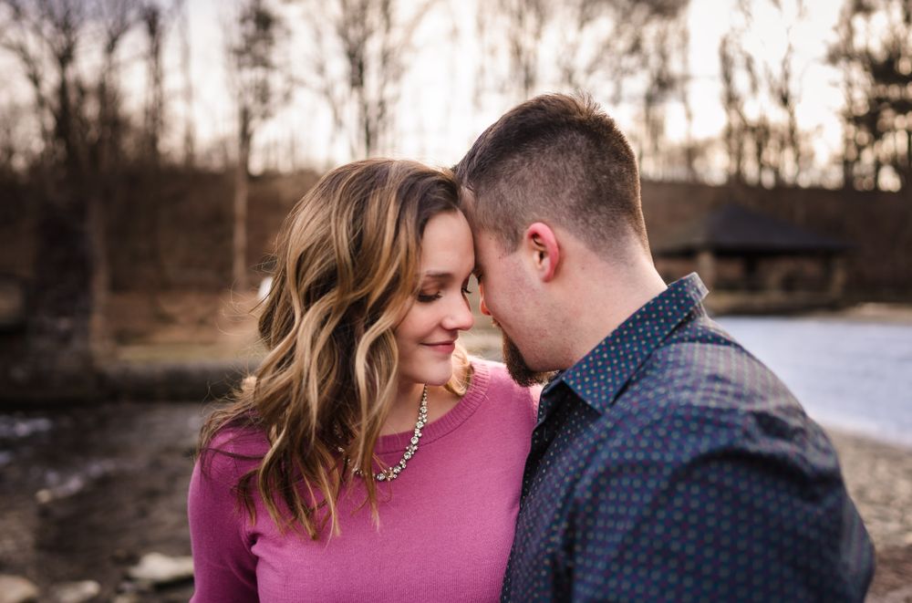 Romantic winter engagement portrait with soft natural lighting.