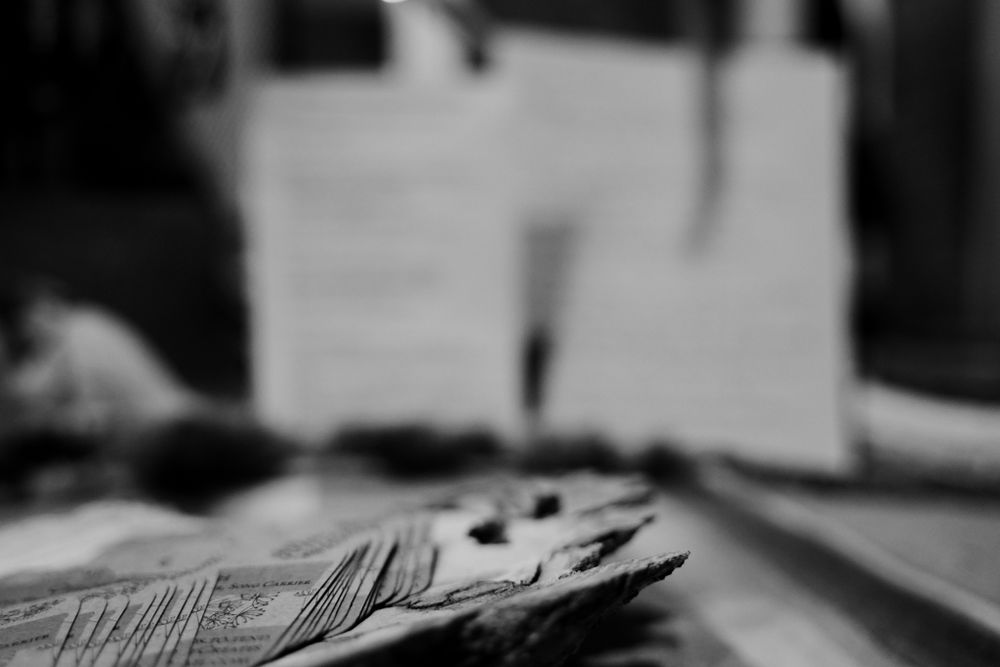 Blurred artistic black and white macro shot of paper money.