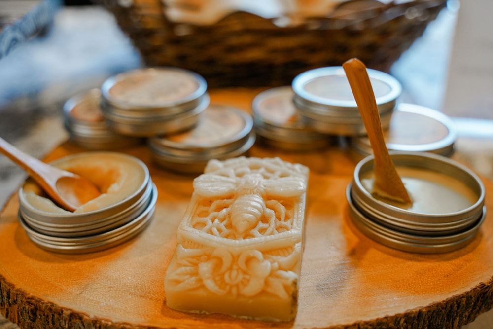 Wooden slice display with mason jars and handmade decorative soap bars.