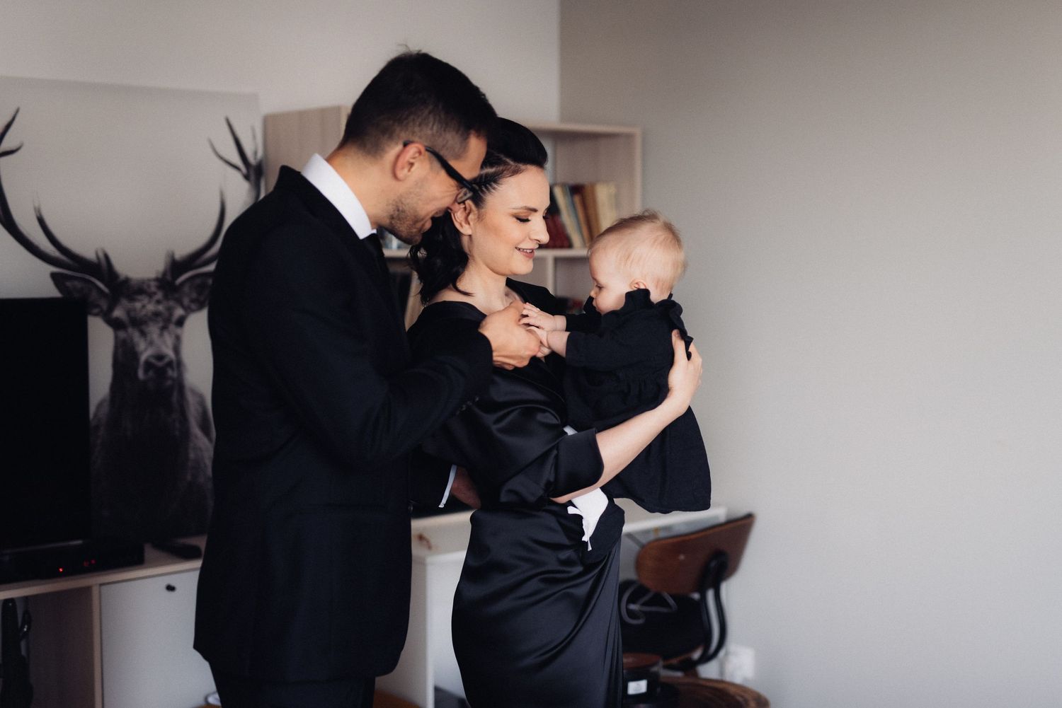 A family shares a tender moment together in their modern living room.
