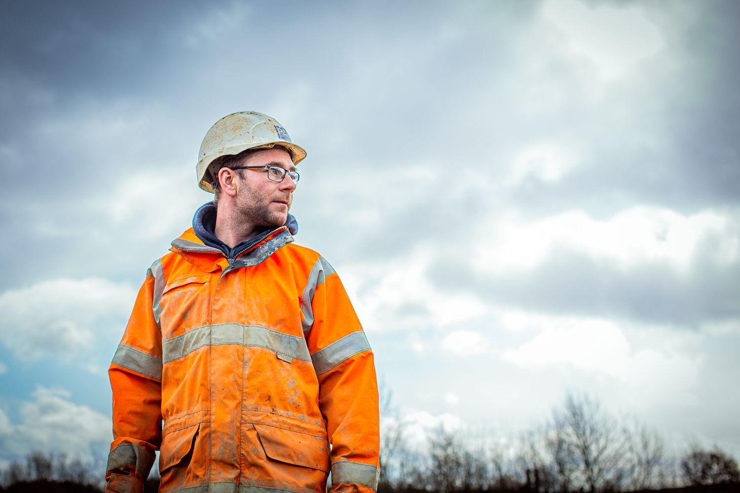 Construction Site Worker in orange hi-vis PPE Photographed by Shot By Gary Brown