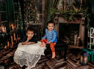 Cozy indoor holiday scene with decorative lighting and Christmas decor.