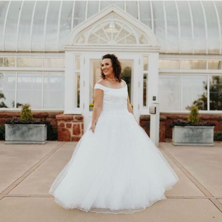 Bride with stunning soft glam makeup by Gaby Makeup Artistry, on a sunny day in Oklahoma City.