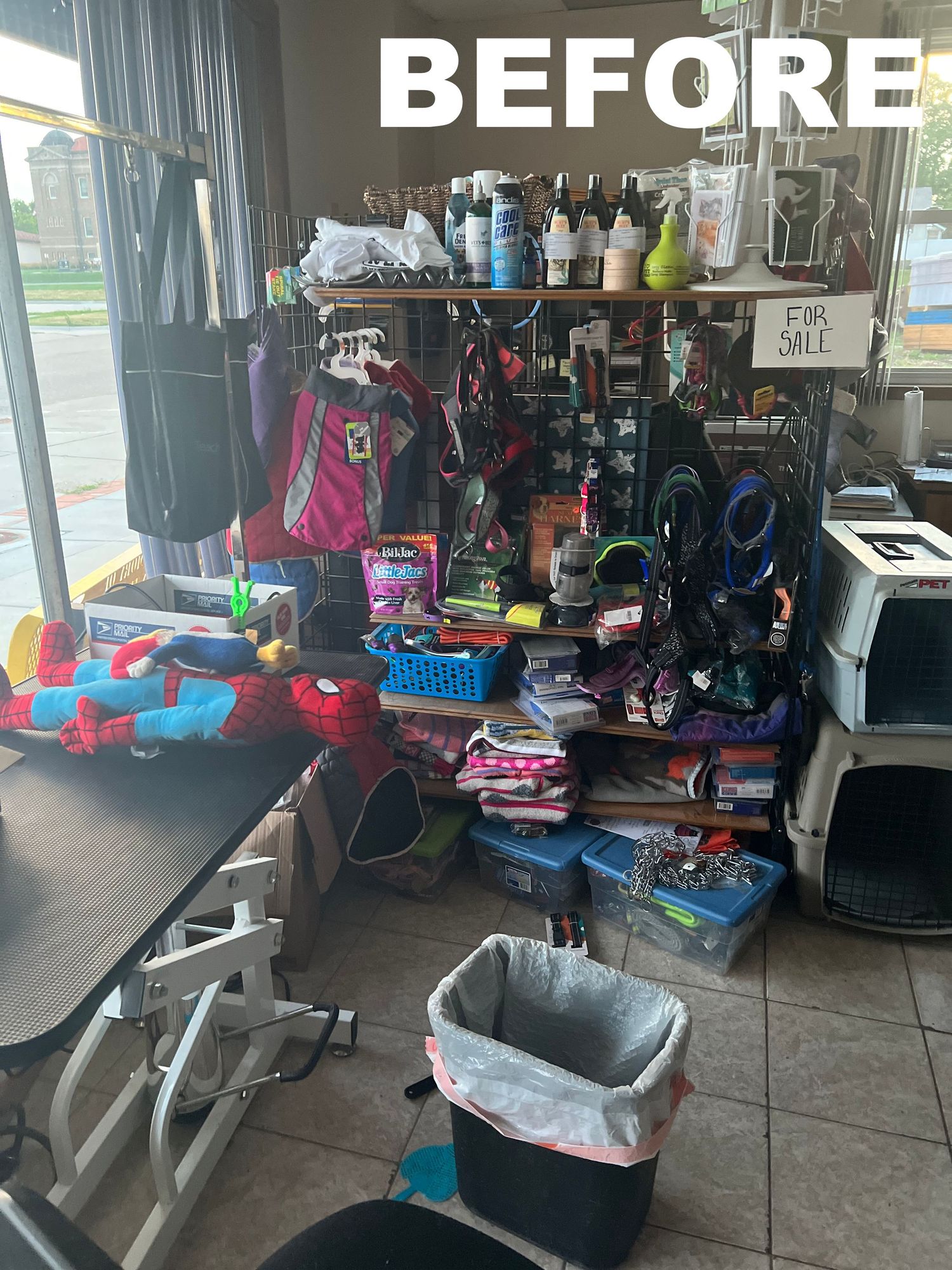 Cluttered exercise room with fitness equipment and various items scattered throughout.