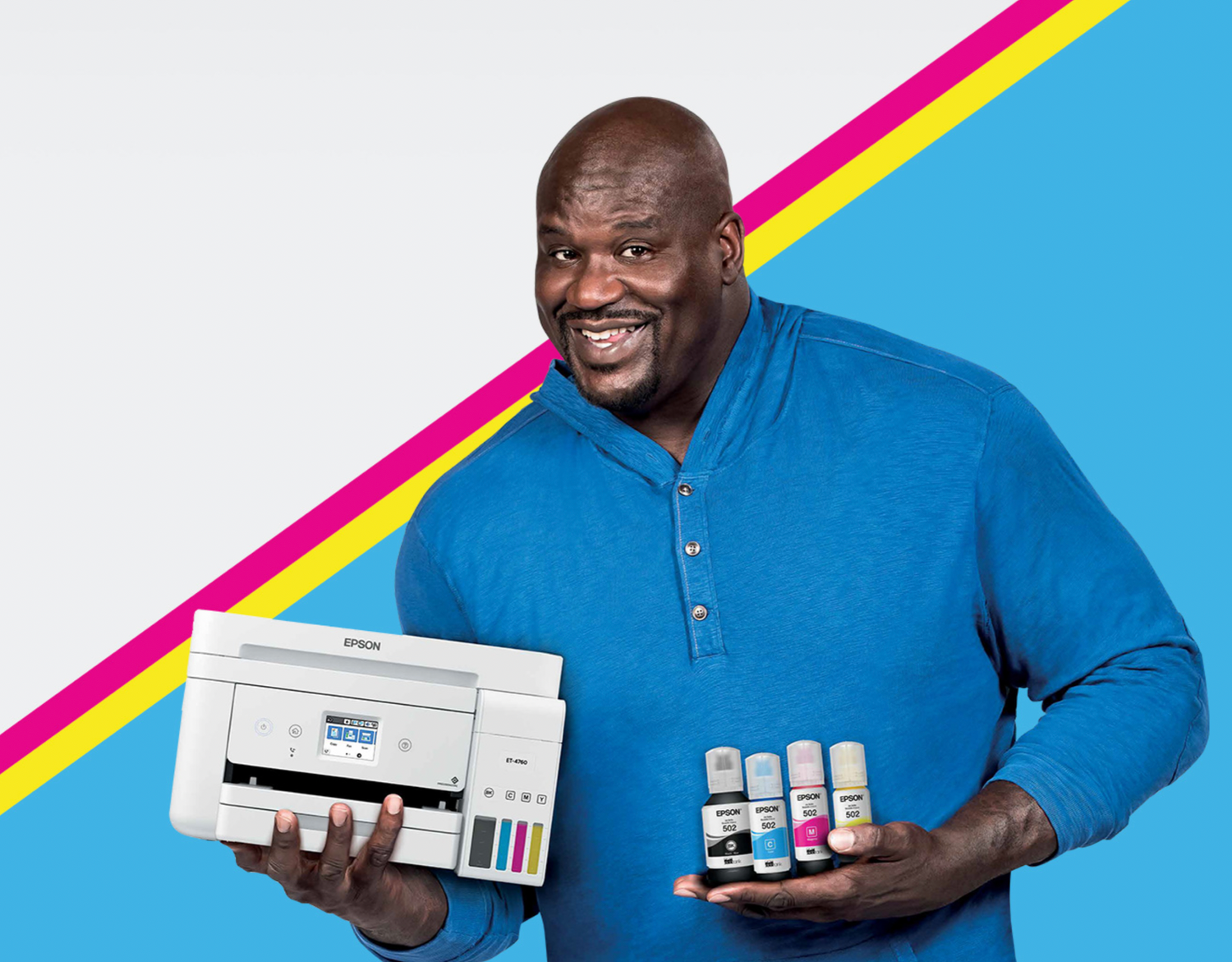 Smiling person in blue sweater holding printer cartridges against colorful geometric background.