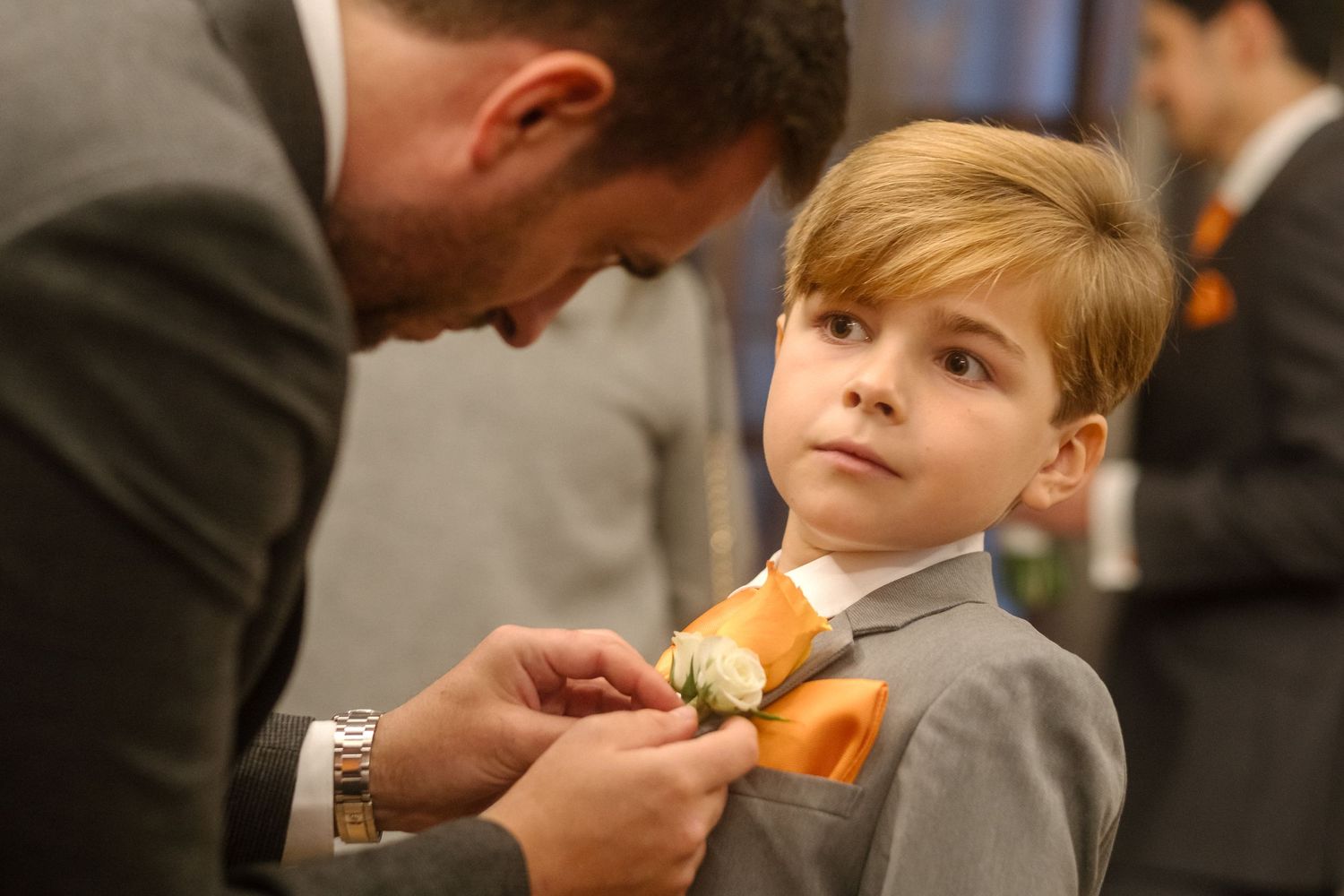 The ring bearer gets his tie adjusted before a wedding at Old Marylebone Town Hall.