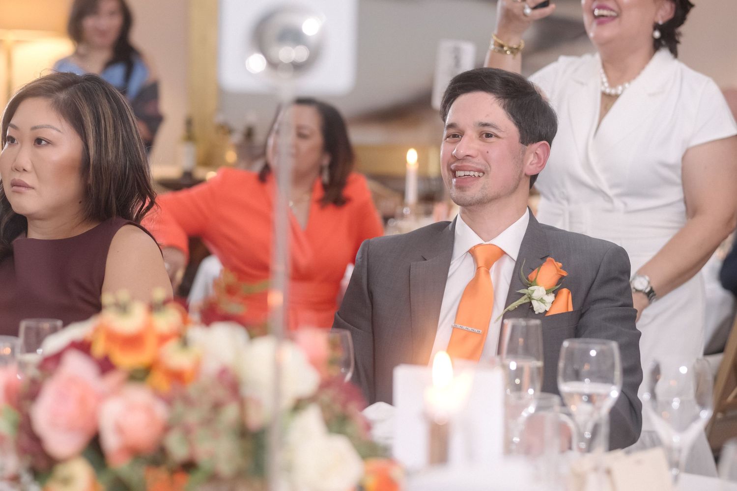 Guests at a London wedding sit and listen to the speeches.