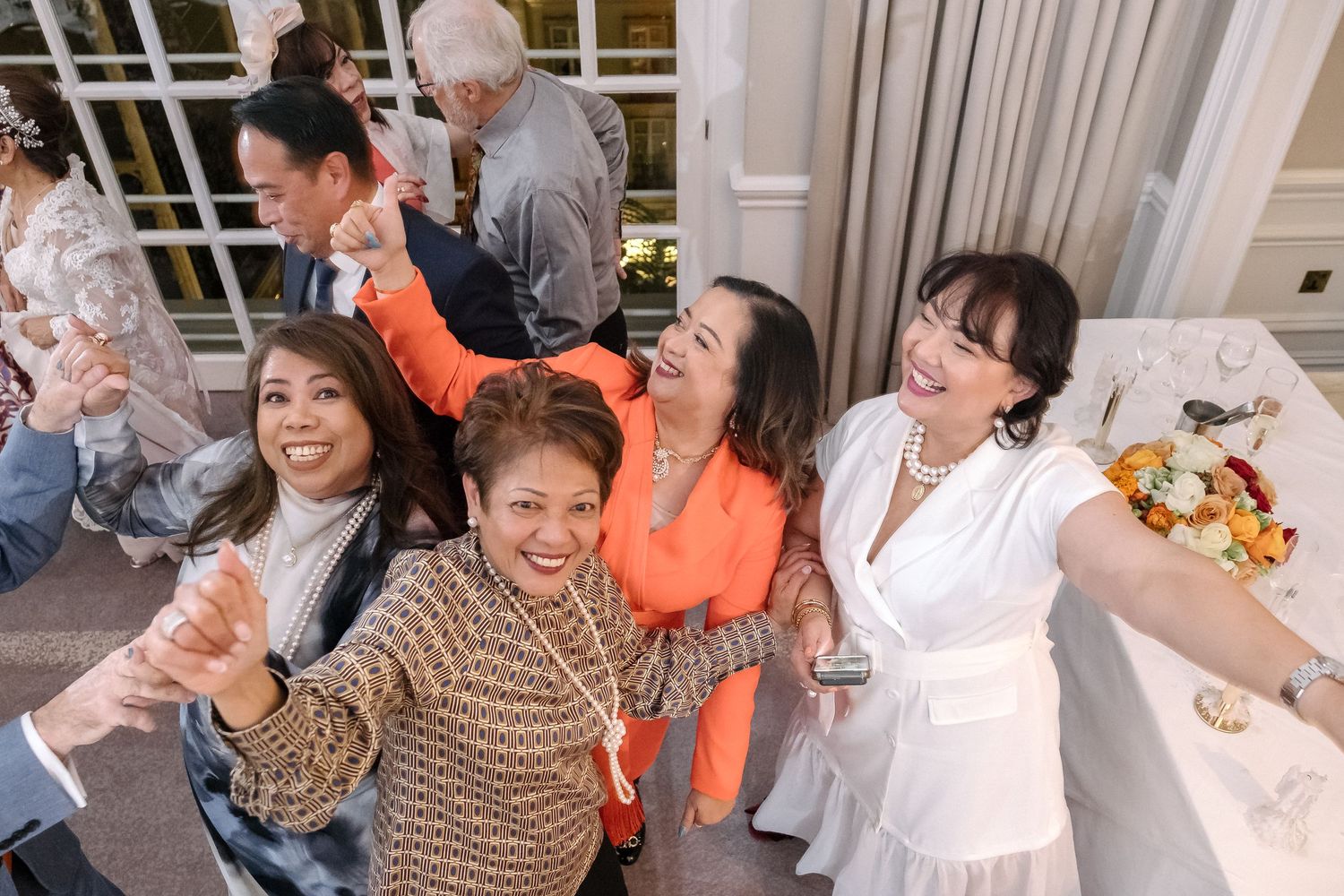 Guests dancing and having fun at a London wedding.