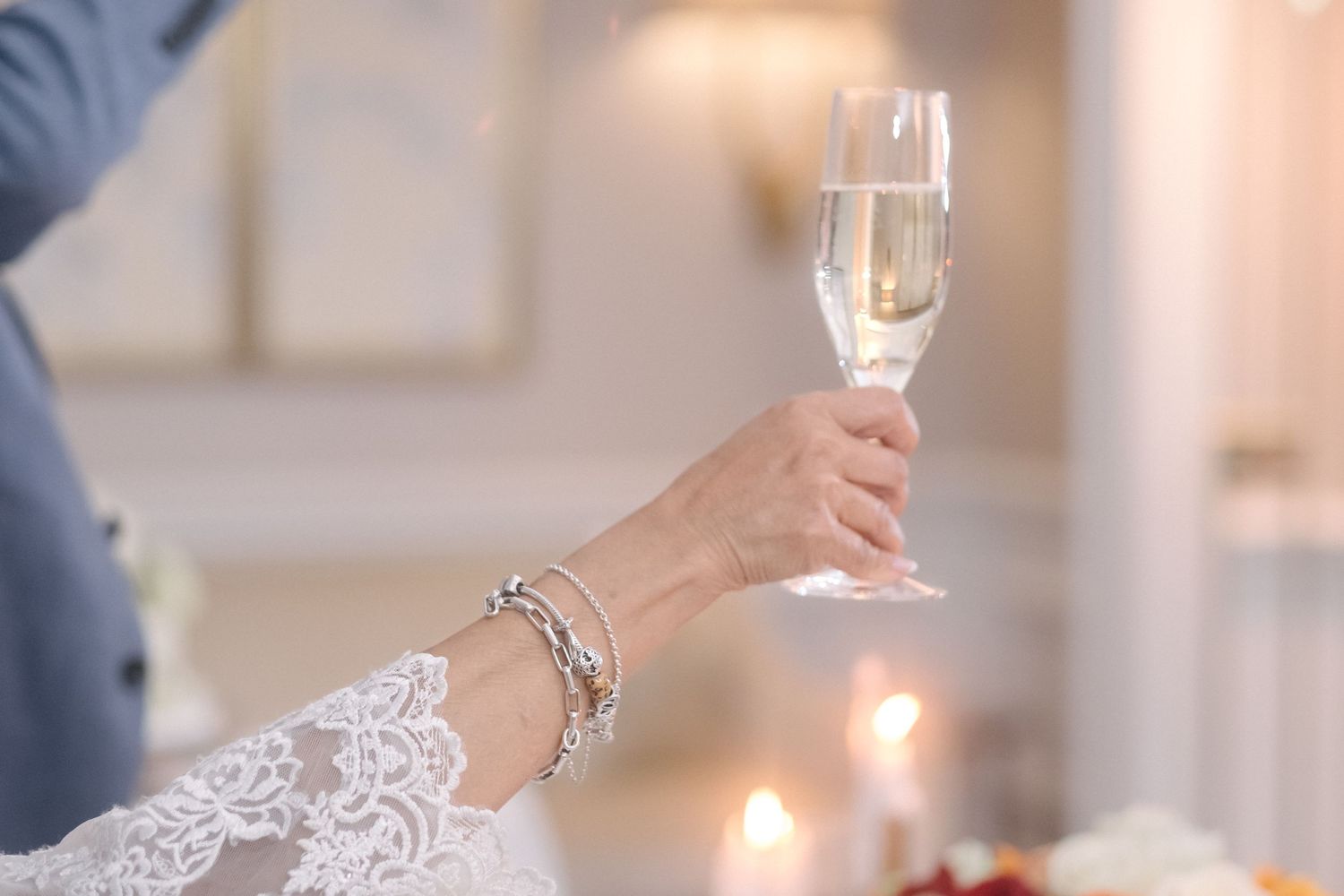 Close up of the bride holding a glass of champagne at a London wedding.