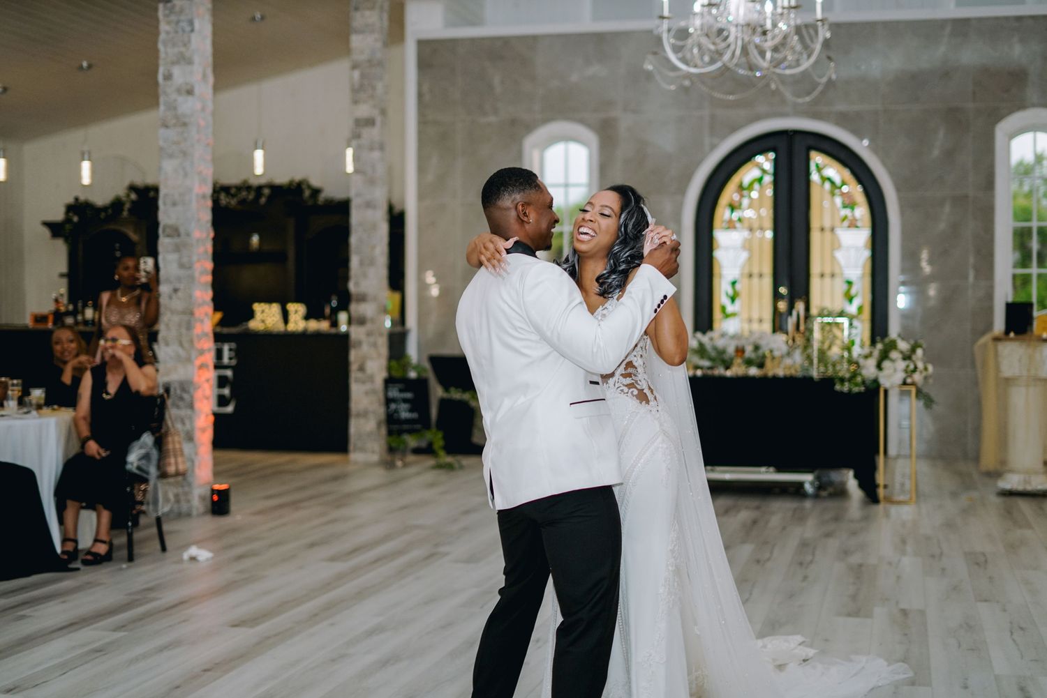 a bride and groom romantically dancing on their wedding day