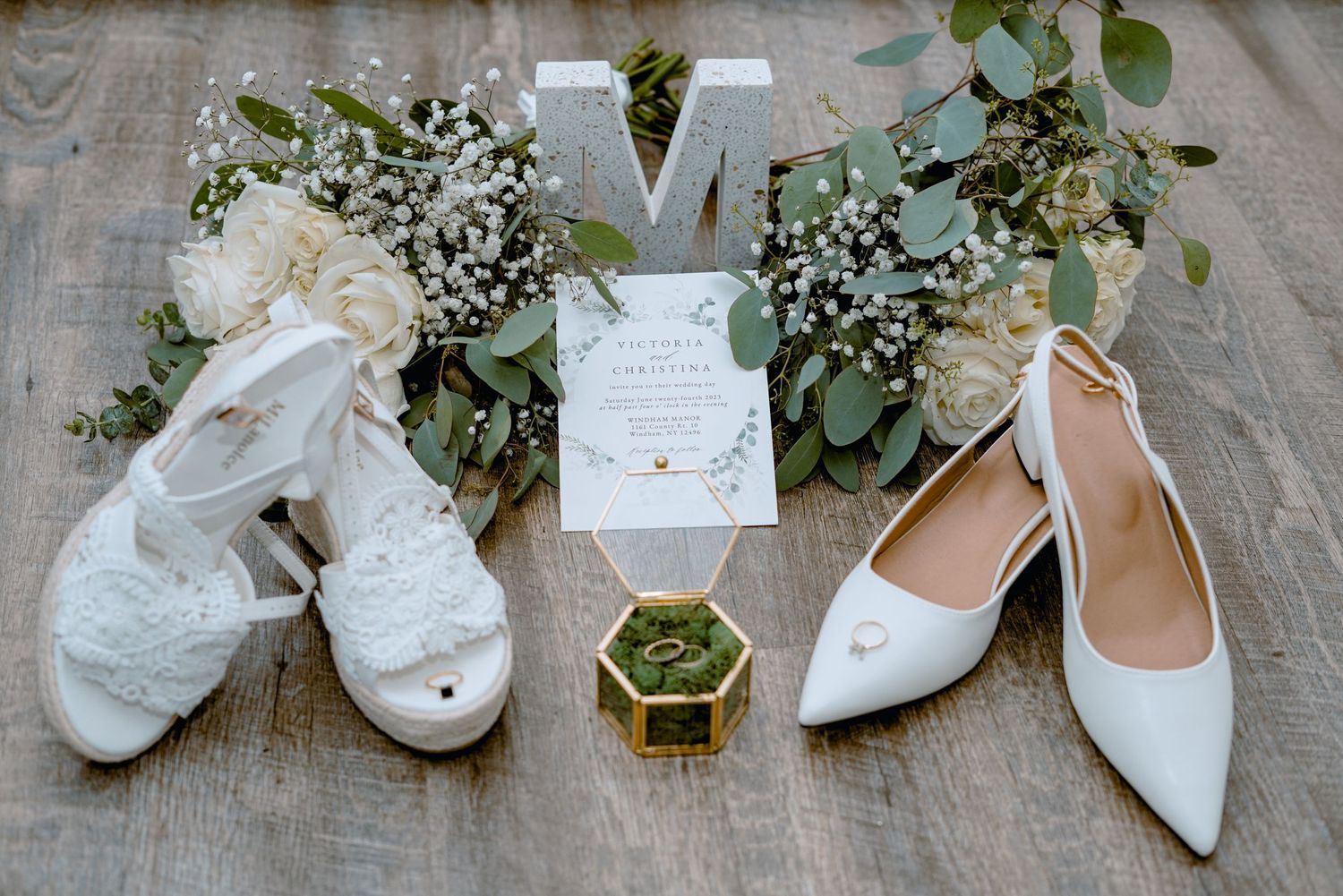 wedding accessories professionally set up on a a decorative wood floor