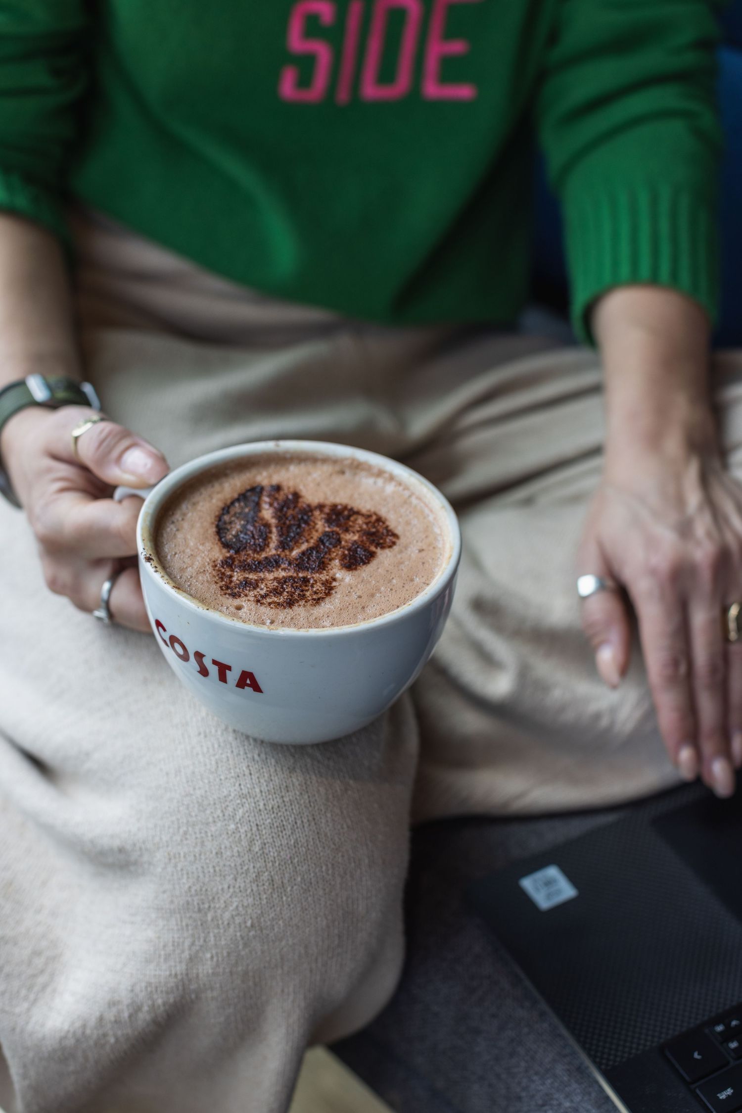 Close up of model holding a costa coffee as part of an influencer marketing ad campaign for instagram in Brighton.